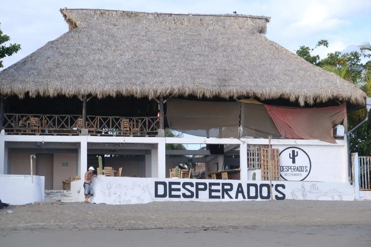 Desperado's — the thatched beachfront palapa next door, at dusk